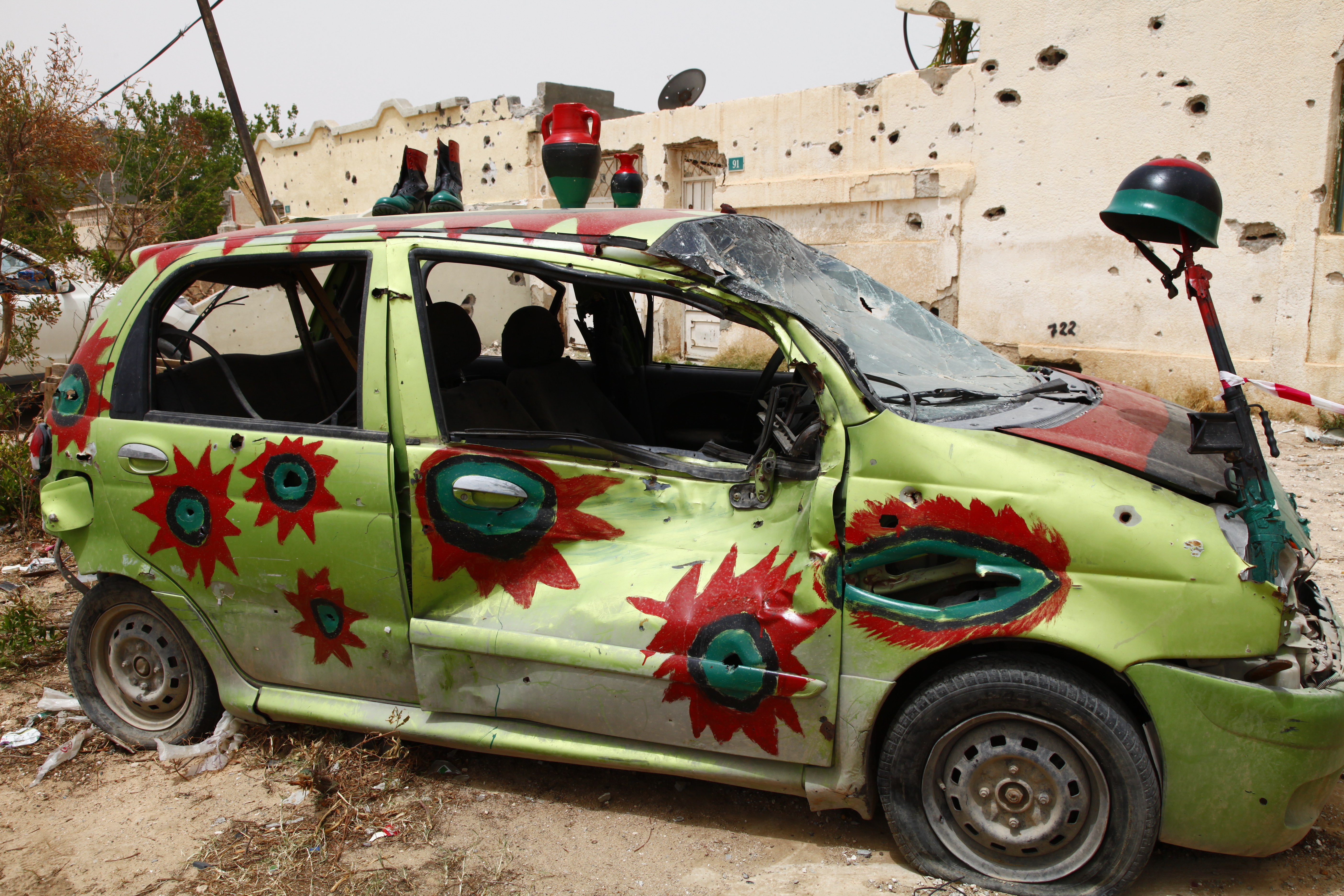 A war car painted with colours of the Libyan flag, Misrata, 2011 Credit: Flickr/ mojomogwai