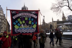 City banner makes it's way through the march